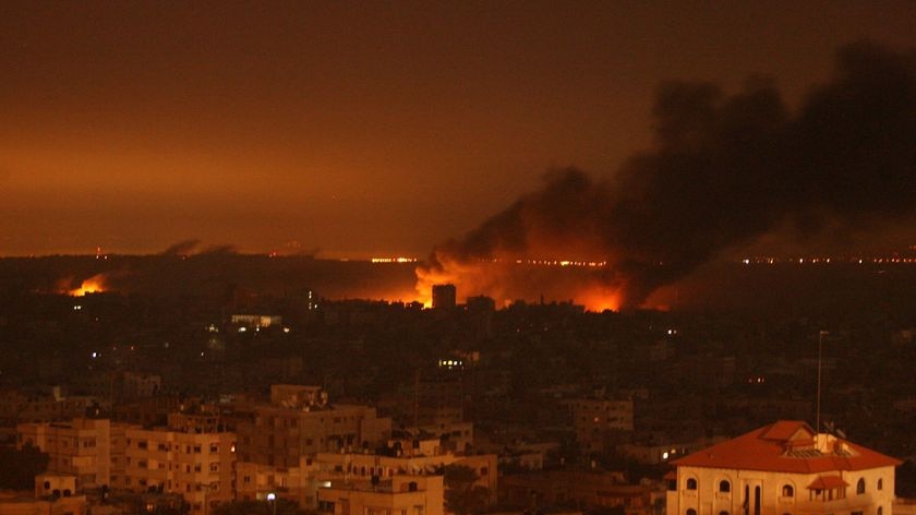 Smoke billows from fires raging on the edge of Gaza City