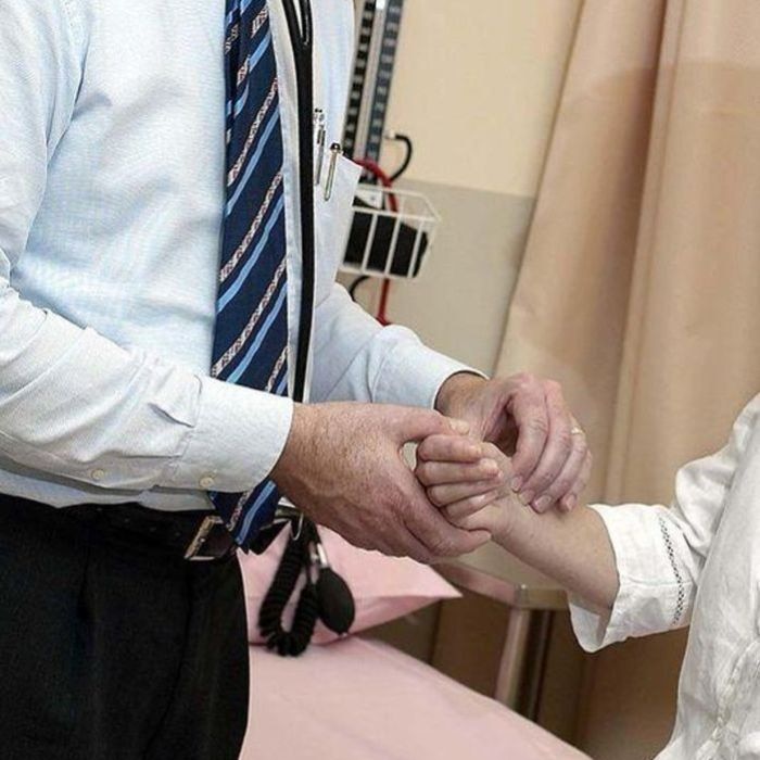 A doctor checks a patient in hospital