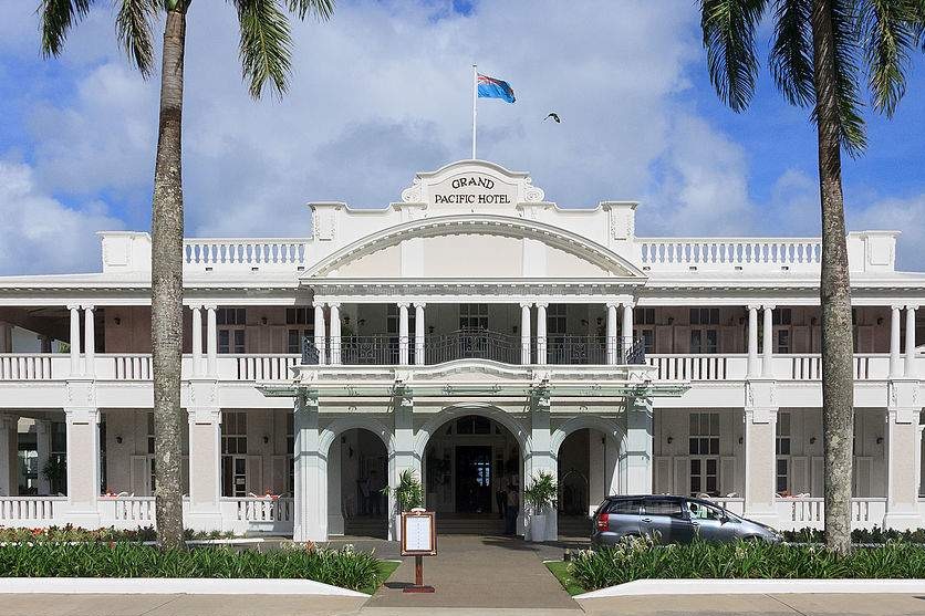 The entrance to the large white building of the Grand Pacific Hotel in Suva.
