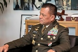 Commander-in-Chief of the Indonesian National Defense Force General Gatot Nurmantyo sits in a chair wearing full uniform.