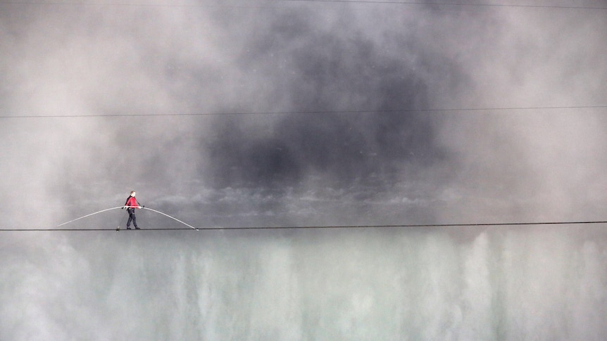 Aerialist Nik Wallenda tightropes over the Niagara Falls June 15, 2012 in Niagara Falls, Canada.