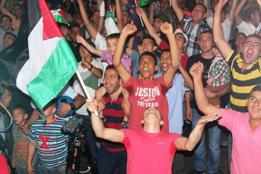 Fan in Ramallah cheer Palestine team