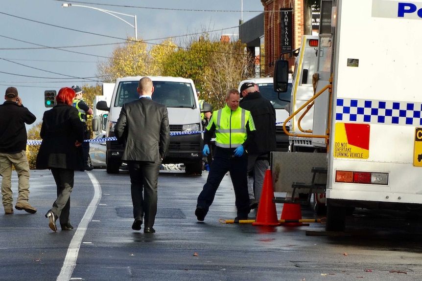 Police officers at the scene of the fatal Brighton shooting.