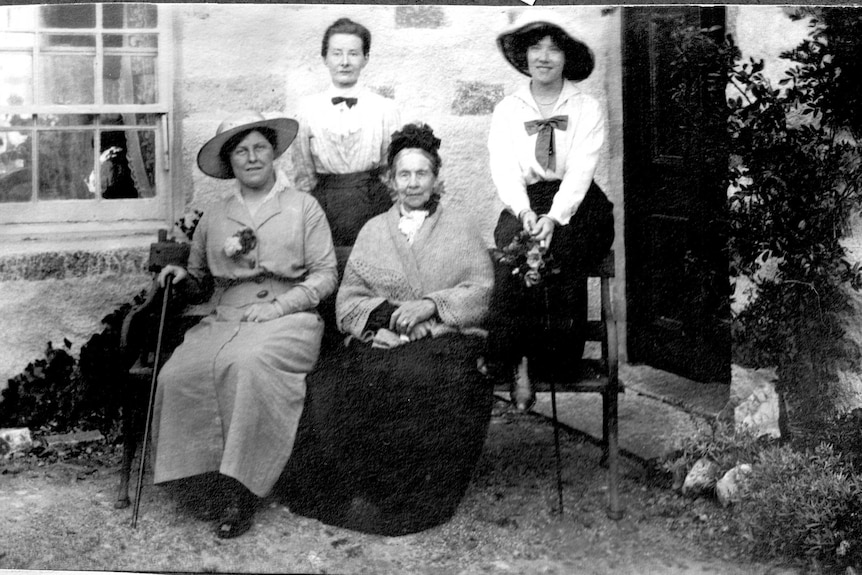 Rena Sara sits with three other members of her family.