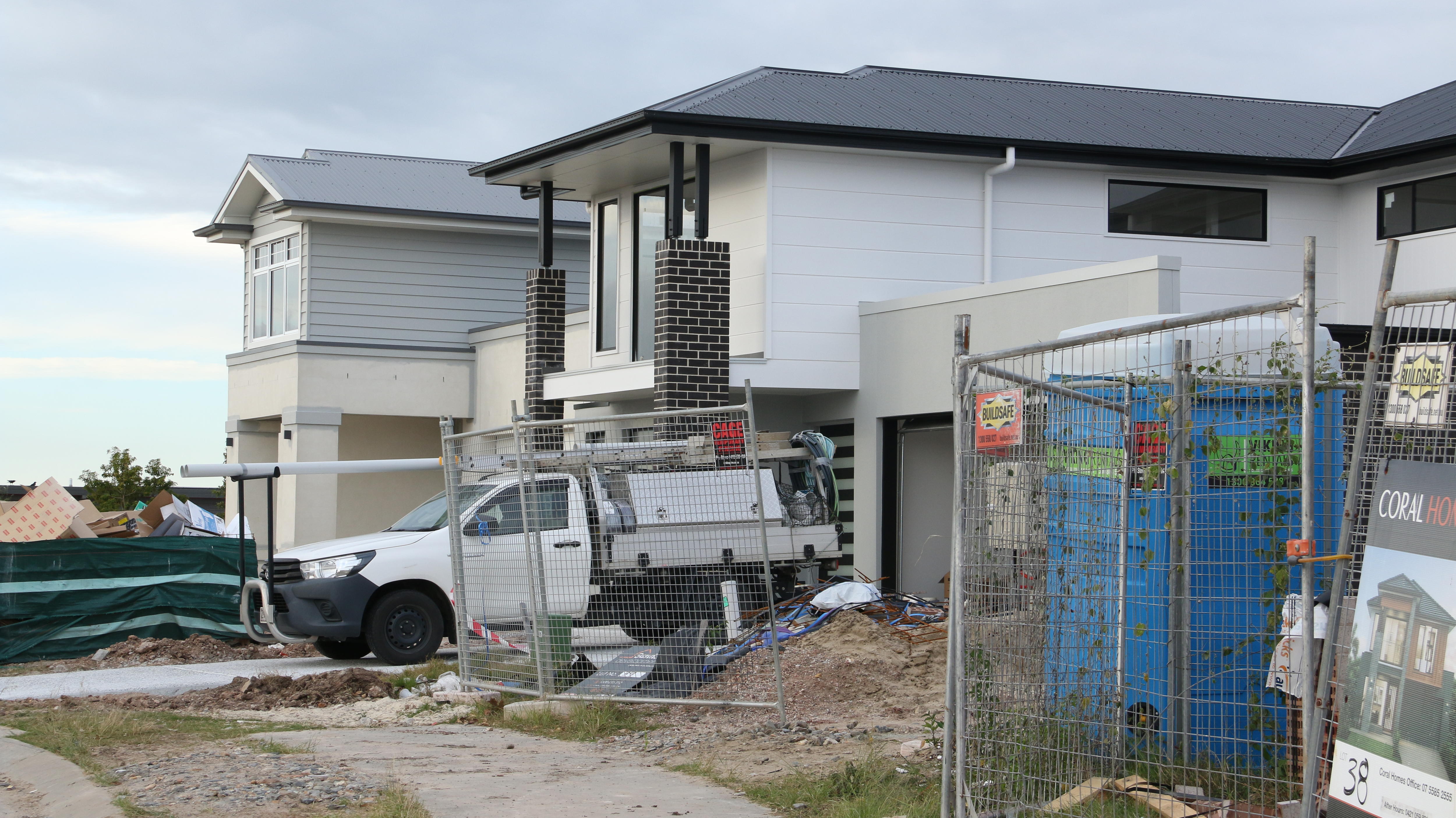A construction site with a ute parked out the front. 