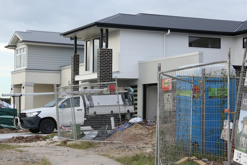 A construction site with a ute parked out the front. 