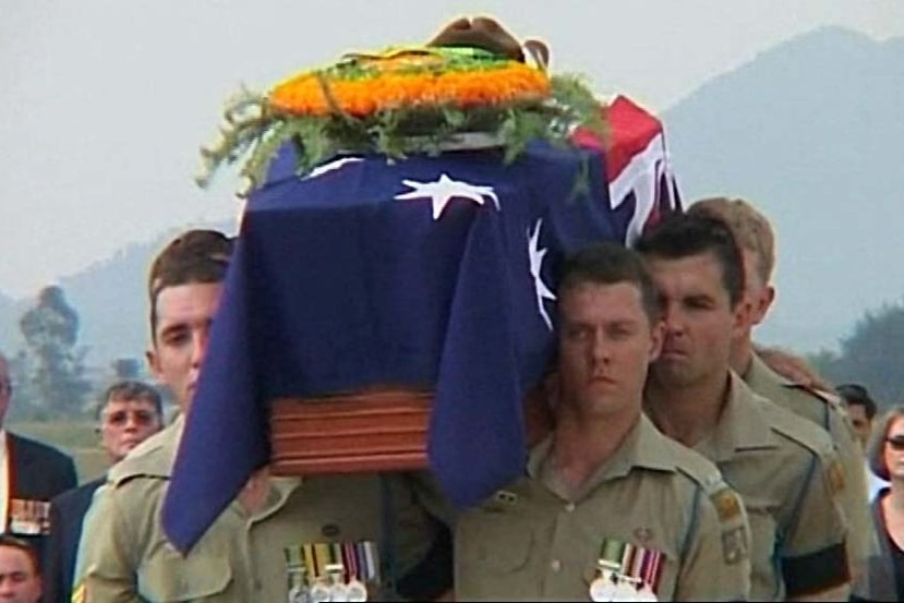 Army pallbearers carry the flag-draped coffin of one of the two bodies returned from Vietnam in 2007.