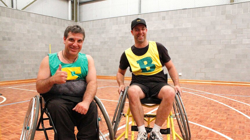 Jamie Elphinstone (left) and his brother Larry after playing wheelchair AFL together