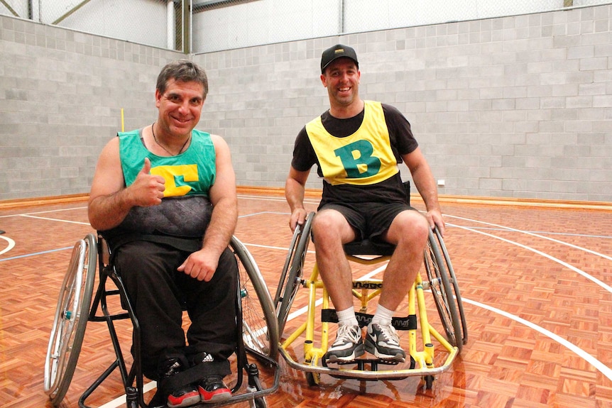 Jamie Elphinstone (left) and his brother Larry after playing wheelchair AFL together