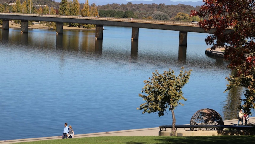 View of Commonwealth Avenue Bridge over Lake Burley Griffin during Autumn when leaves changing colour.