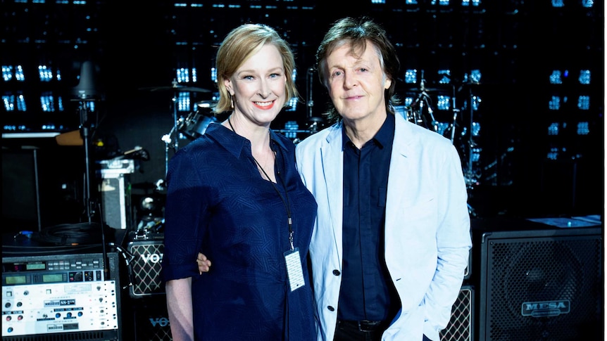 Paul McCartney and Leigh Sales pose for a photograph on stage in Perth