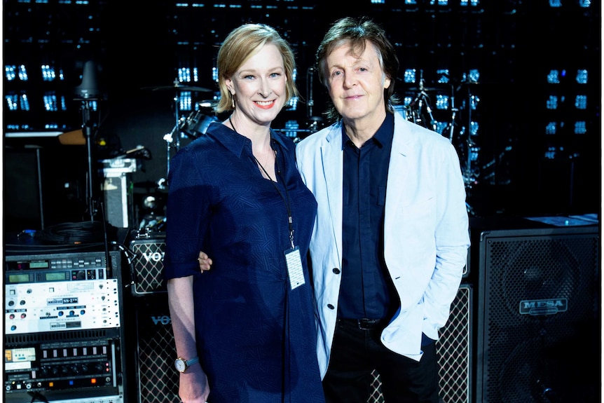 Paul McCartney and Leigh Sales pose for a photograph on stage in Perth