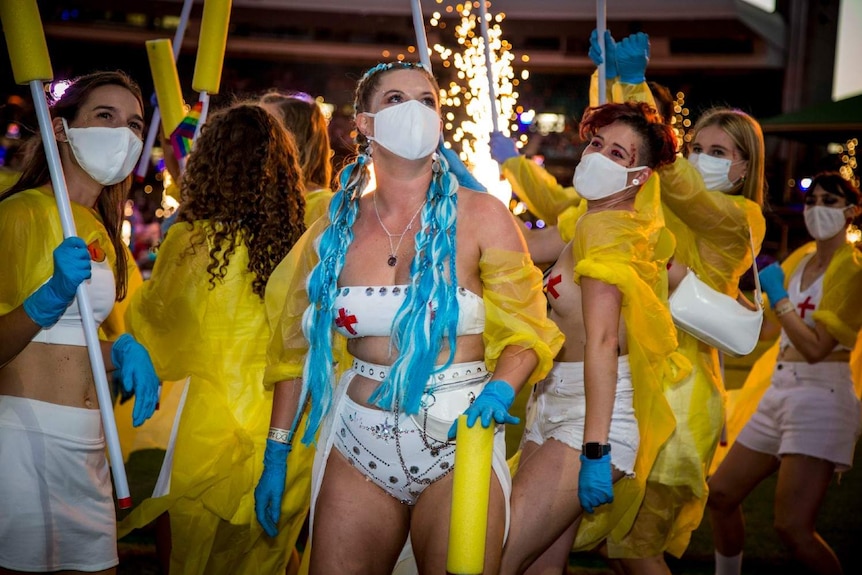 women wearing white masks over their nose and mouth