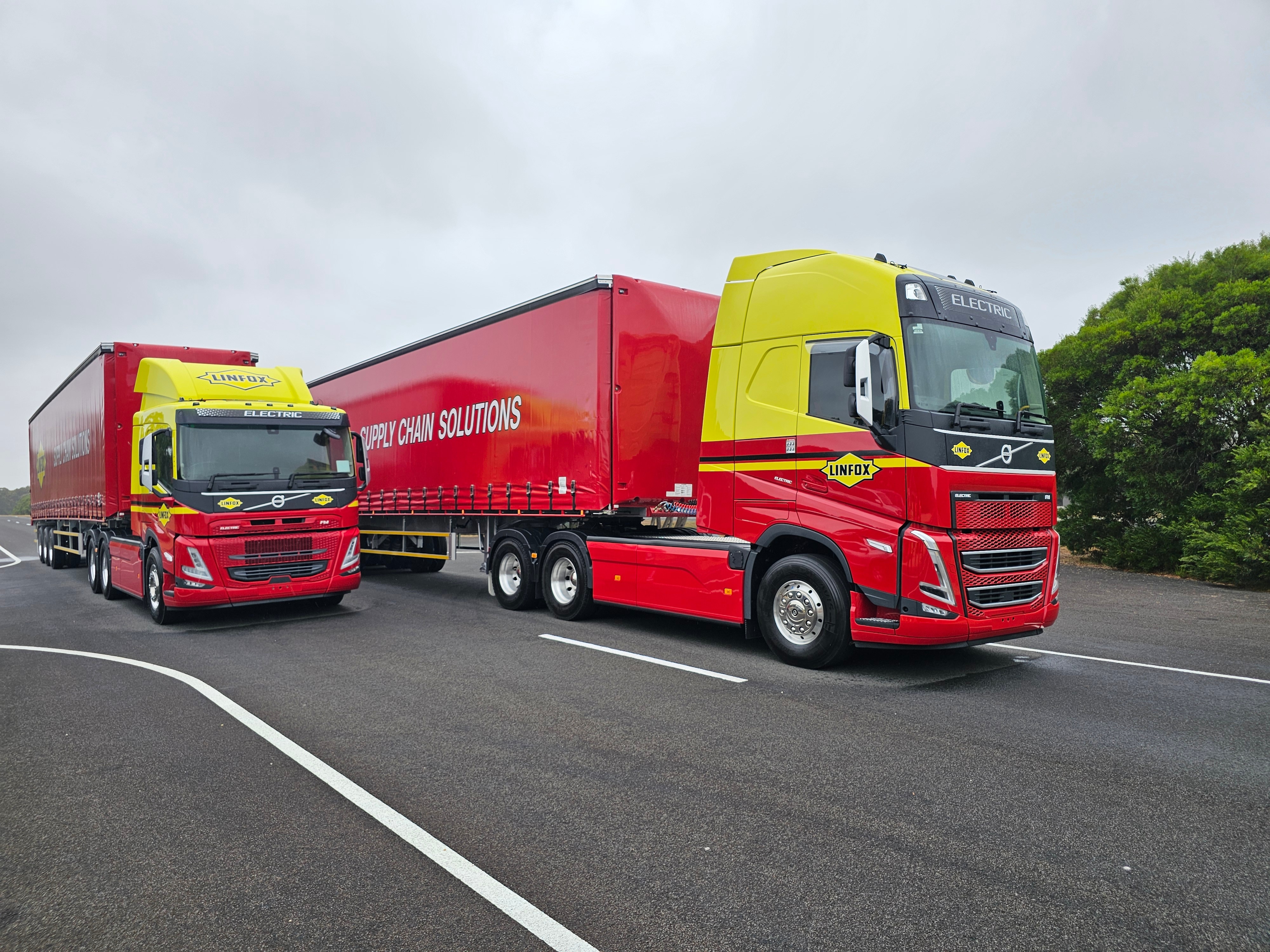 Two red and yellow trucks.