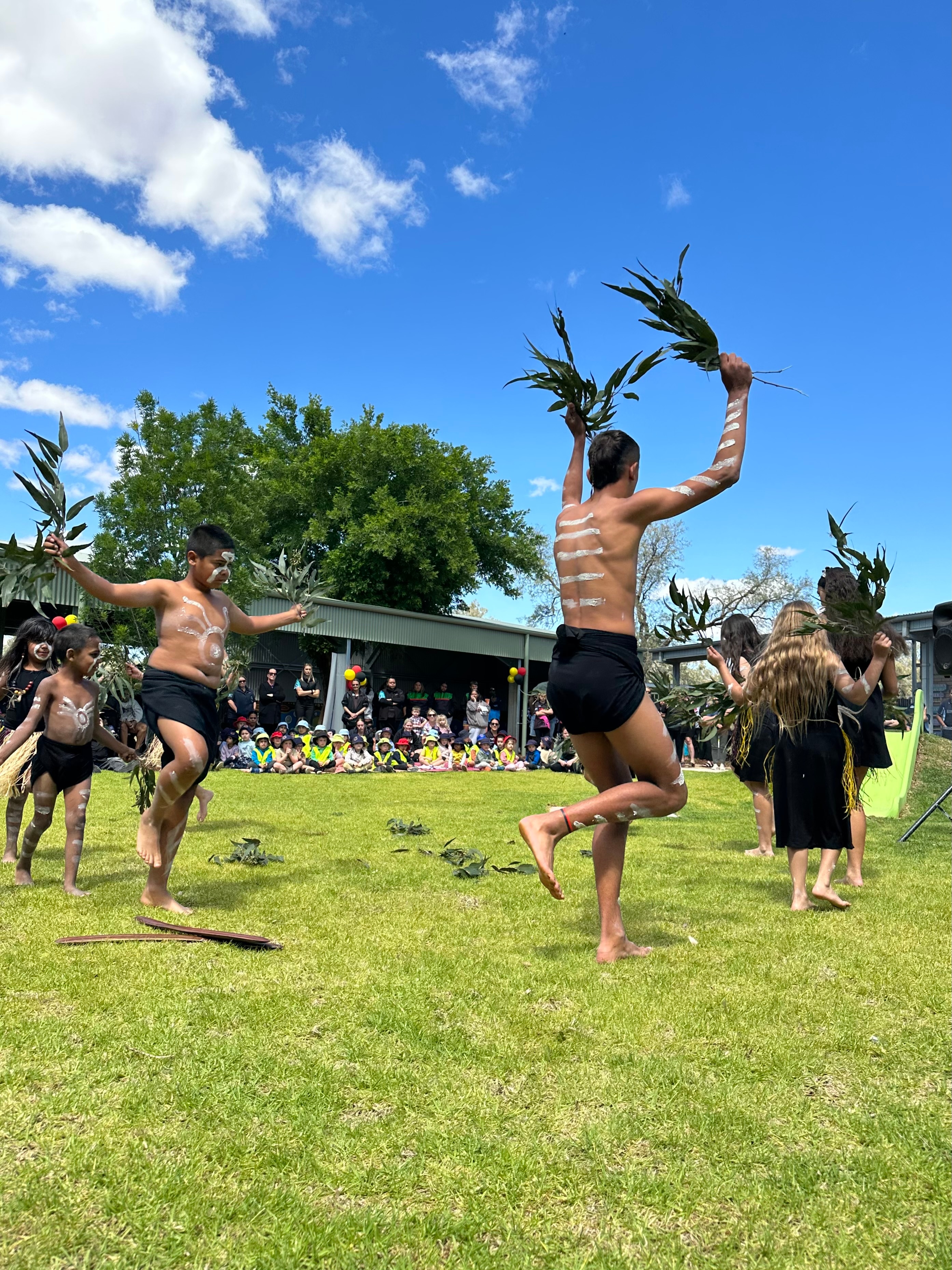 Young indigenous people doing a traditional dance. 