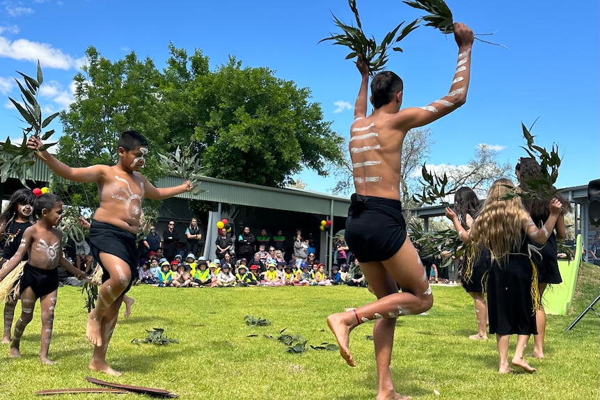 Young indigenous people doing a traditional dance. 