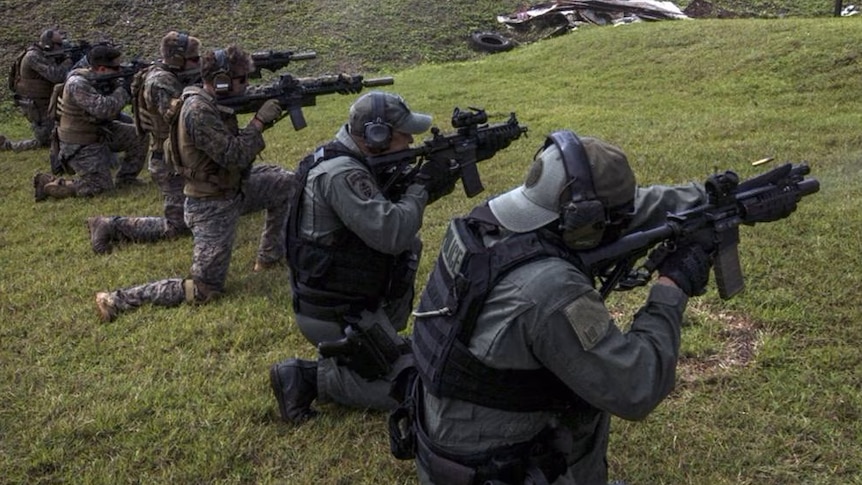 US soldiers practice shooting on Guam.