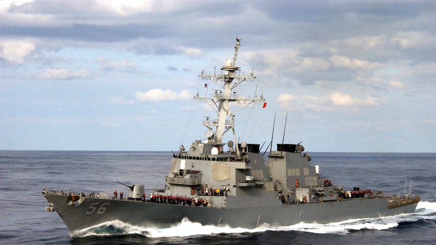 A guided missile destroyer USS John S. McCain in the sea.
