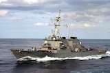 A guided missile destroyer USS John S. McCain in the sea.