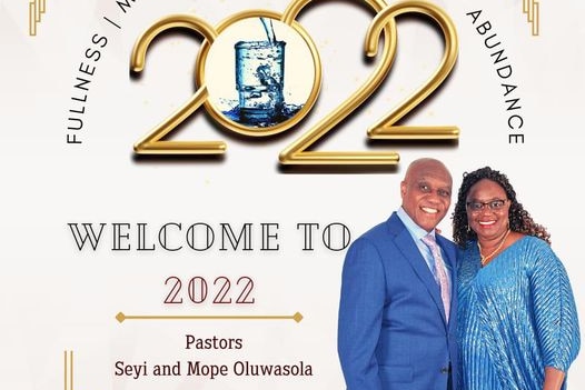 An image of a flyer showing two people standing on the right, with the words "Welcome to 2022" on the left.