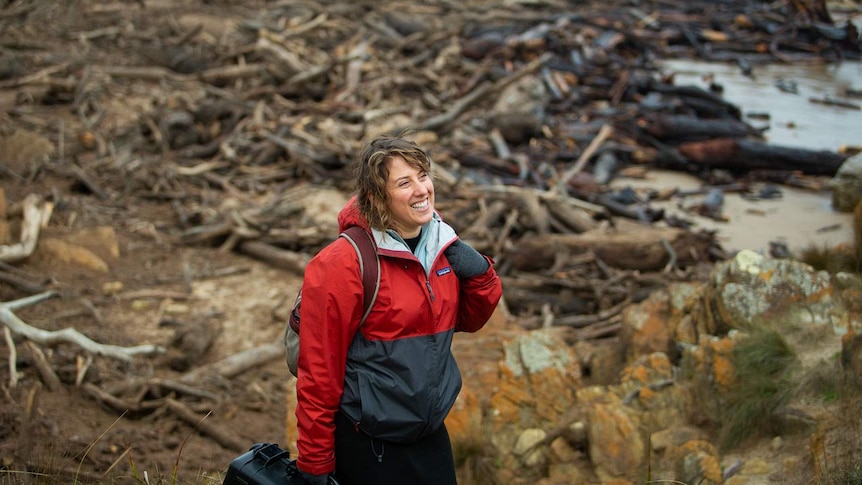 Rachel Meyers readies to head off through a field of driftwood