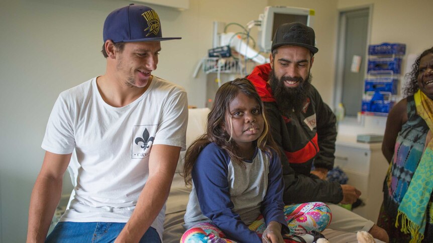 Essendon Bombers players Mark Baguley and Courtenay Dempsey visit Zahara in hospital