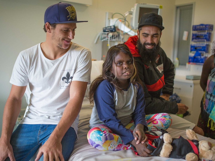 Essendon Bombers players Mark Baguley and Courtenay Dempsey visit Zahara in hospital