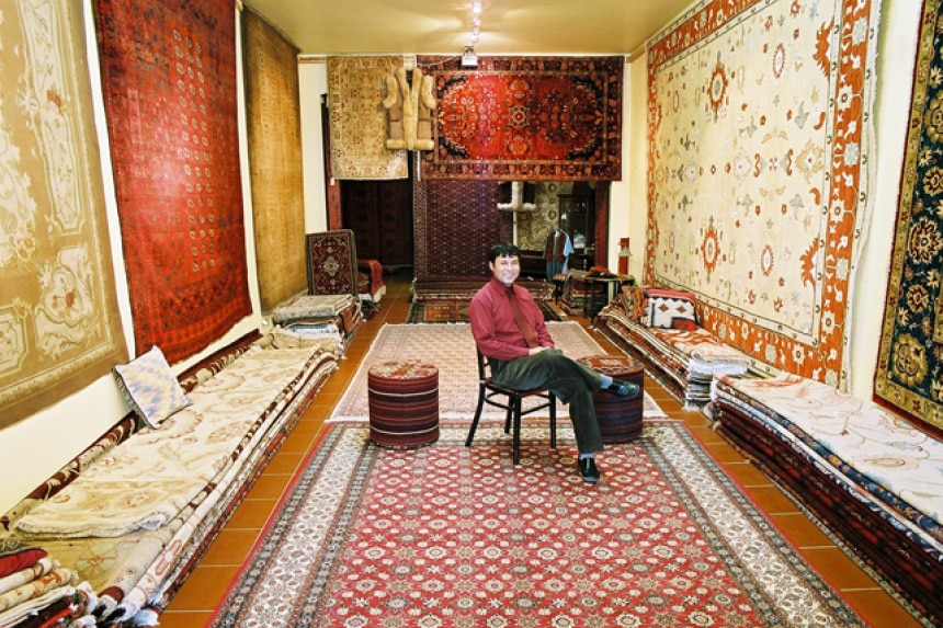 Najaf Mazari inside his rug shop in Prahran, Melbourne