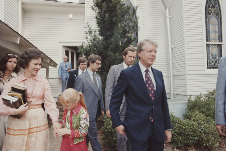 Archival image of Jimmy Carter and family outside a Baptist church in 1976.