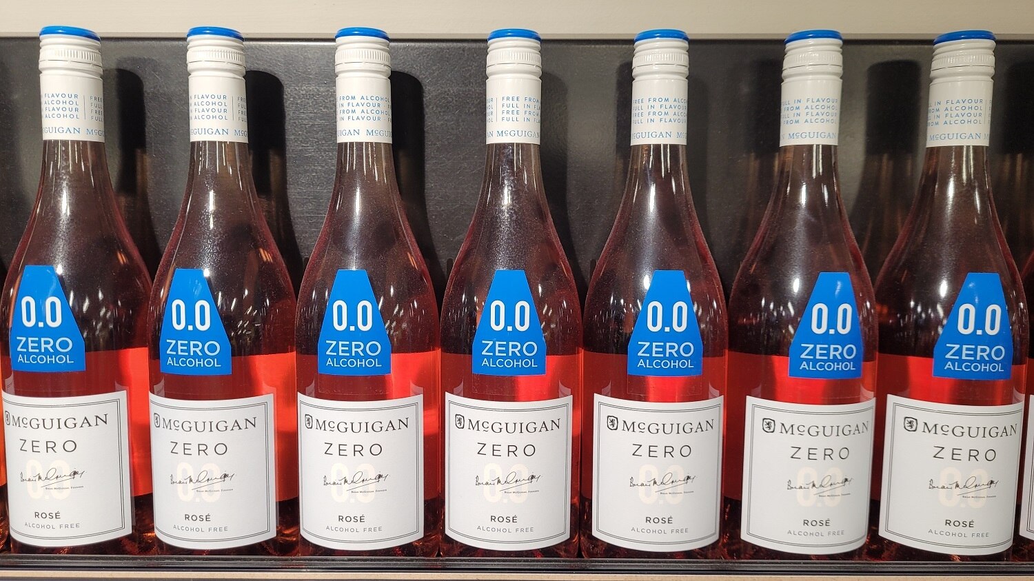 A line of bottles of non-alcoholic wines.