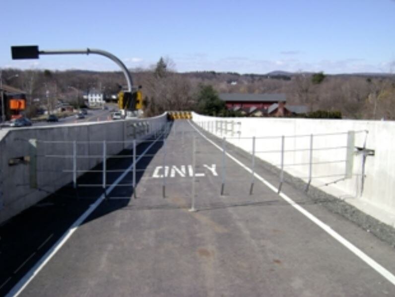 A freeway lane with a net over it