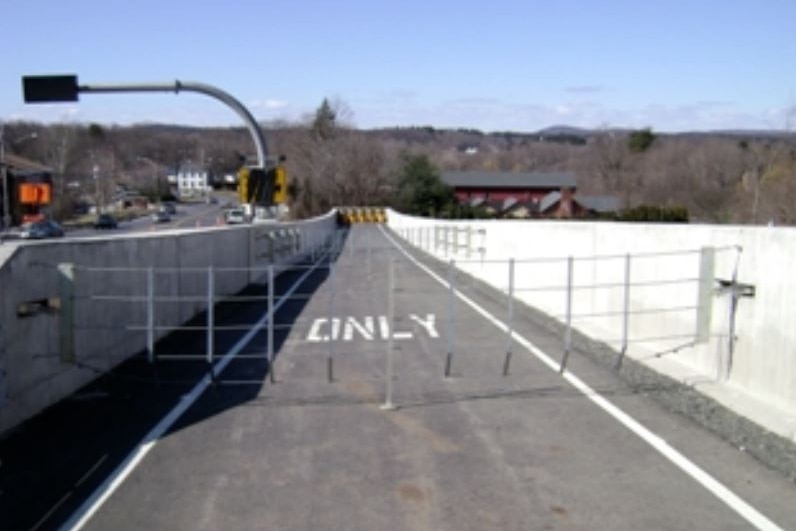 A freeway lane with a net over it