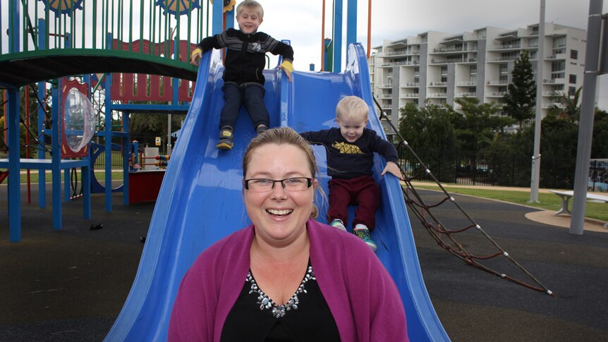 Jacqui on slide with her two boys