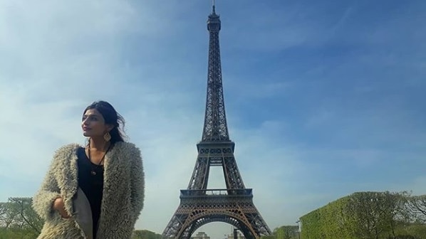 Sadaf Khadem poses in front of the Eiffel Tower