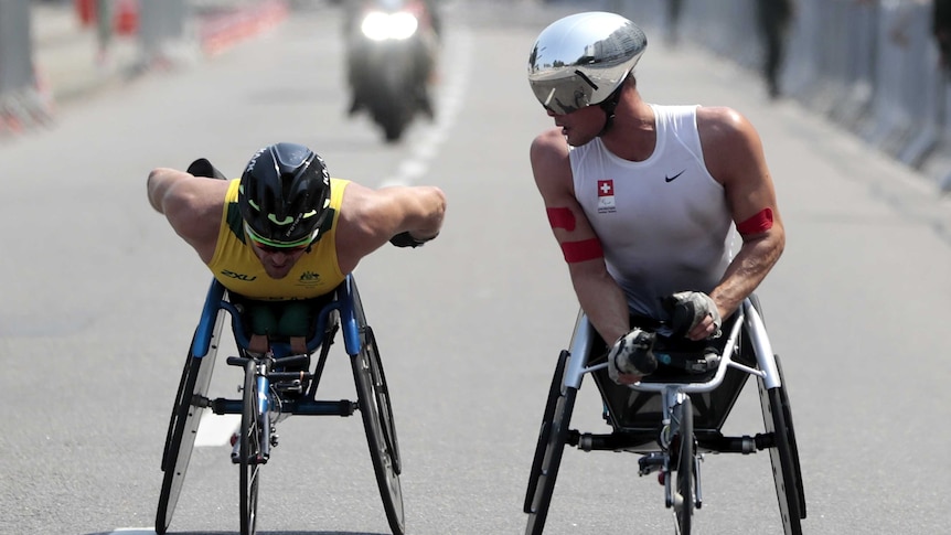 So close ... Kurt Fearnley (L) is pipped for gold by Marcel Hug