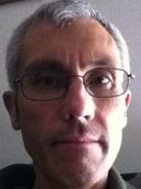 A selfie of a man wearing glasses