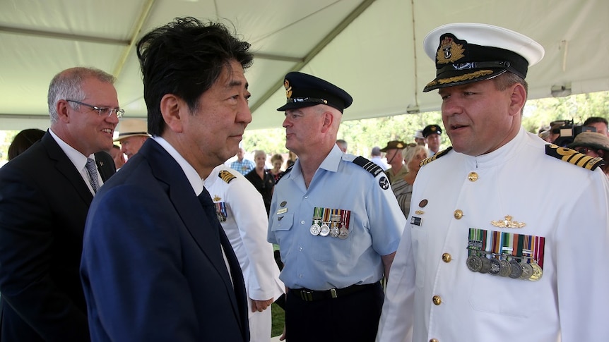 Japan's Prime Minister Shinzo Abe meets with Australian defence force personnel