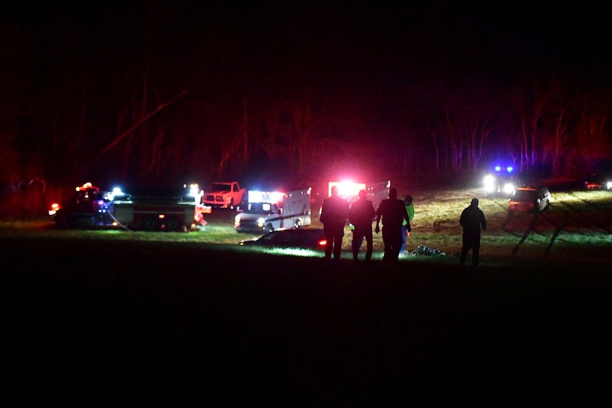 Various emergency vehicles at night