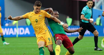 Australia's Tomi Juric battles for the ball against Cameroon