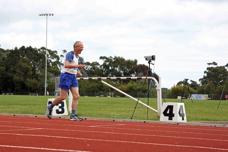 Roger Churchward runs during the Masters Games