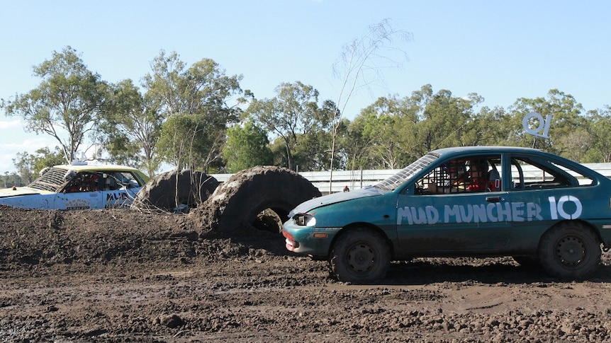 cars at a starting line for mud racing