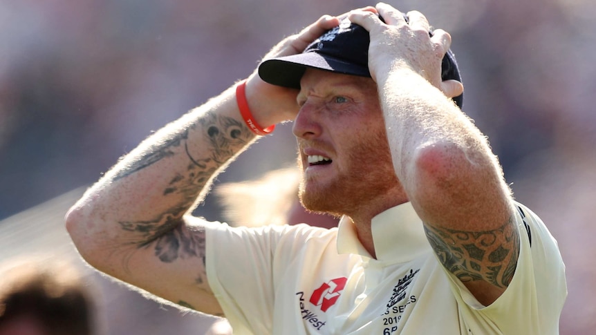 An England cricketer puts his hands on his head in disbelief after winning an Ashes Test.