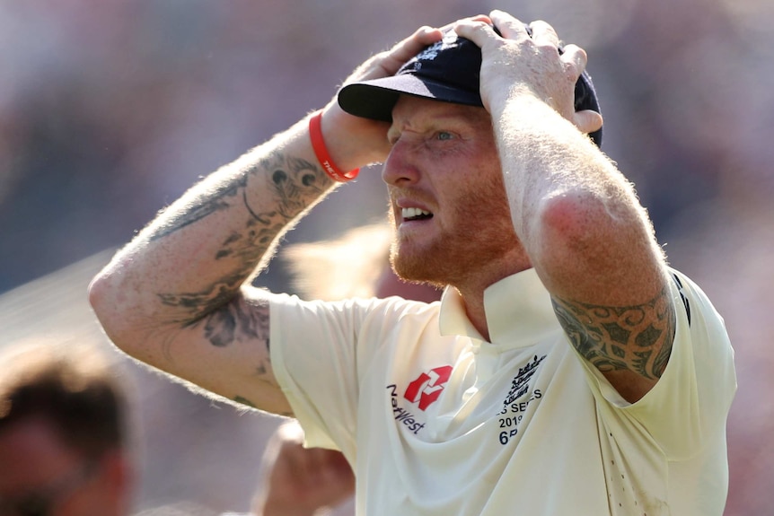 An England cricketer puts his hands on his head in disbelief after winning an Ashes Test.