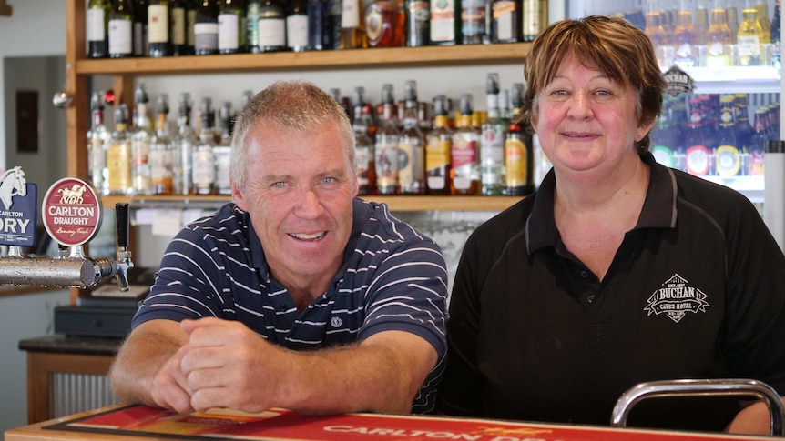 Publicans Greg and Margaret behind the bar