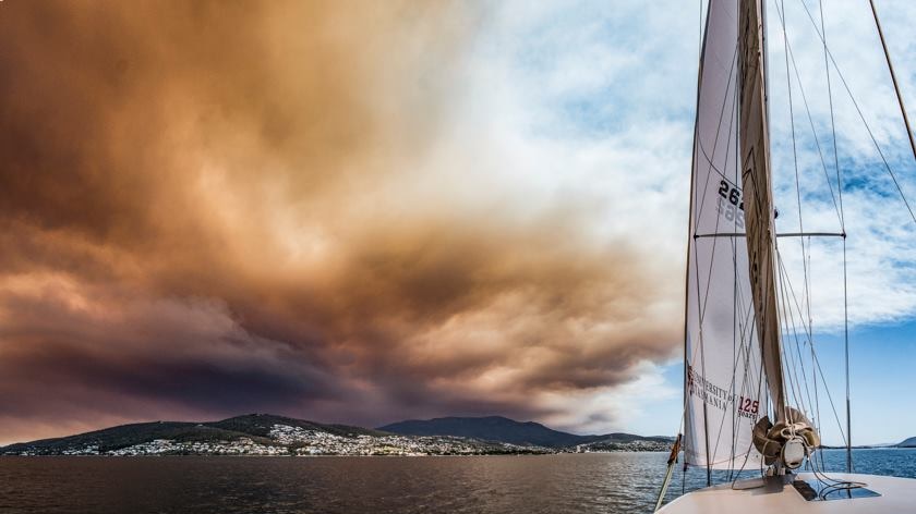 Gell River bushfire smoke over Mount Wellington and Hobart seen from the River Derwent.