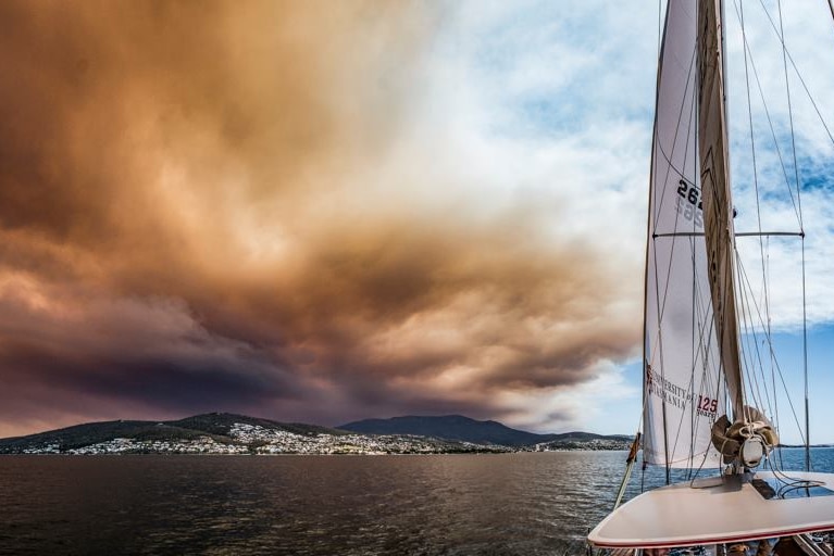 Gell River bushfire smoke over Mount Wellington and Hobart seen from the River Derwent.