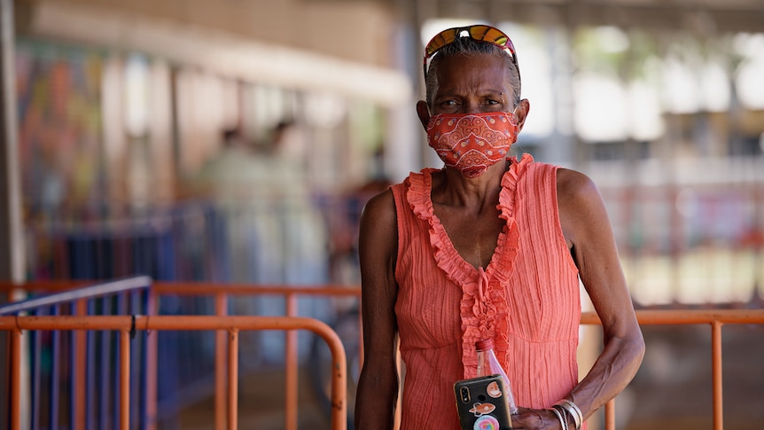 Katherine resident Lynette Hoffman, wearing a mask, looking at the camera, outside a COVID-19 testing site.