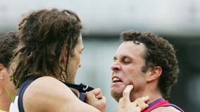 Brendan Fevola of Carlton and Antoni Grover of Freo wrestle