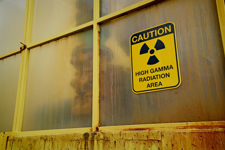 A radioactivity label on a window.