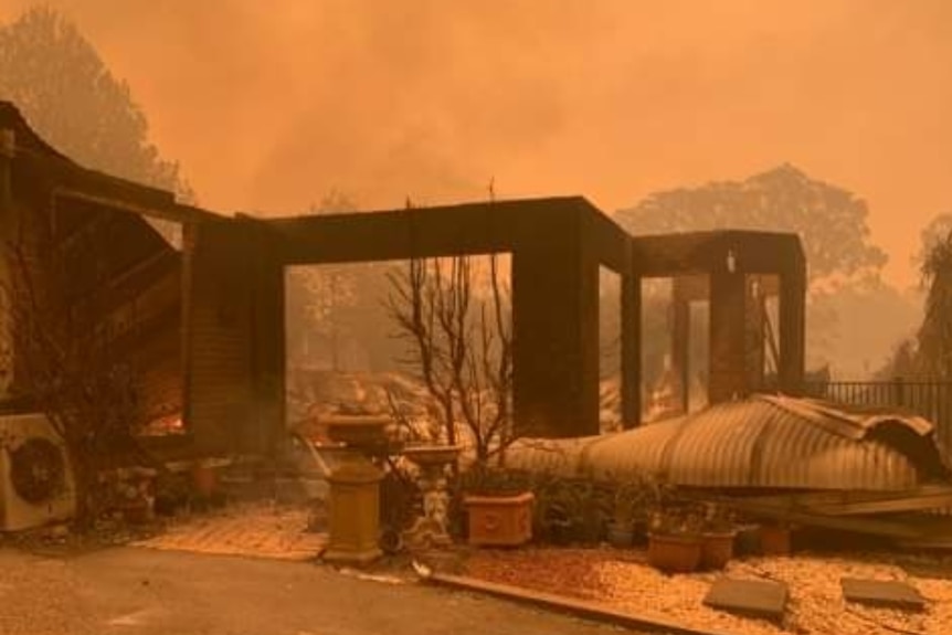 What's left standing of James Findlay's bushfire-damaged family home at Surf Beach in Batemans Bay